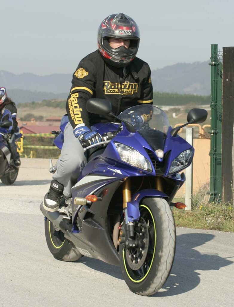 Person Riding Blue Sport Bike Motorcycle