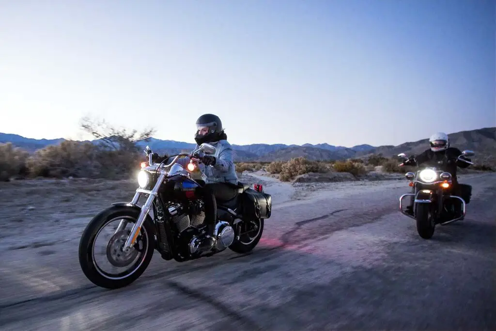 Two People Riding Motorcycles