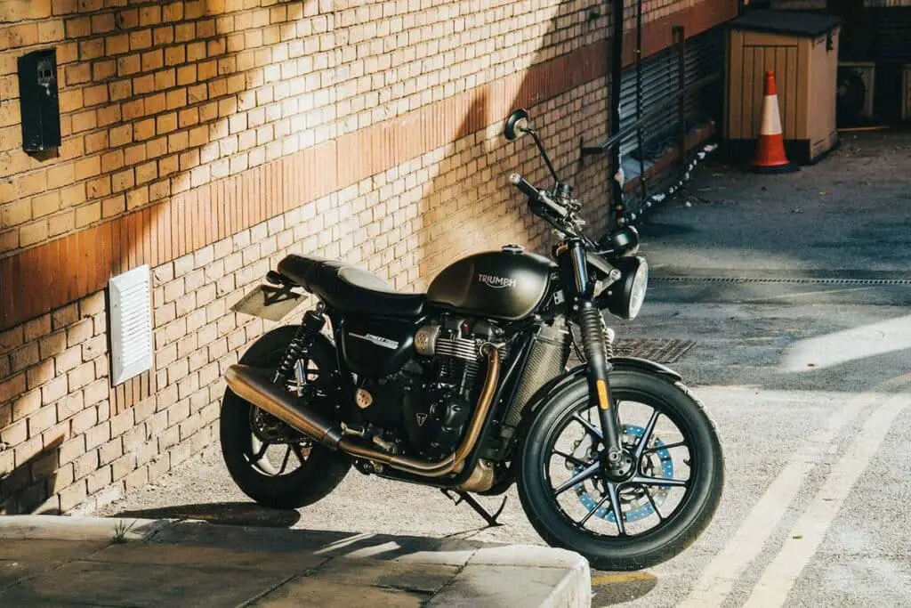 Motorcycle Parked Beside Building