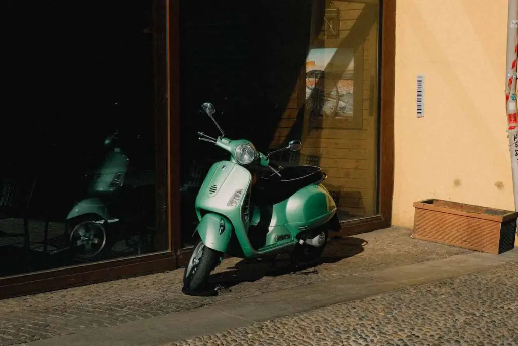 Parked Green Motorcycle Scooter