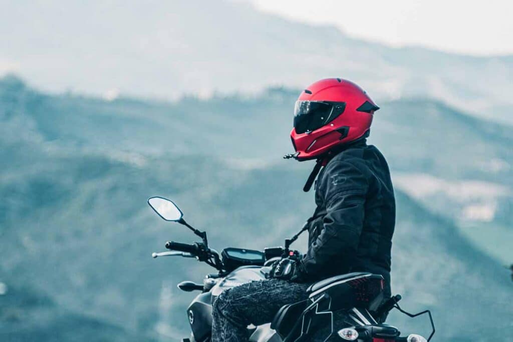 Motorcycle Rider with a Red Helmet