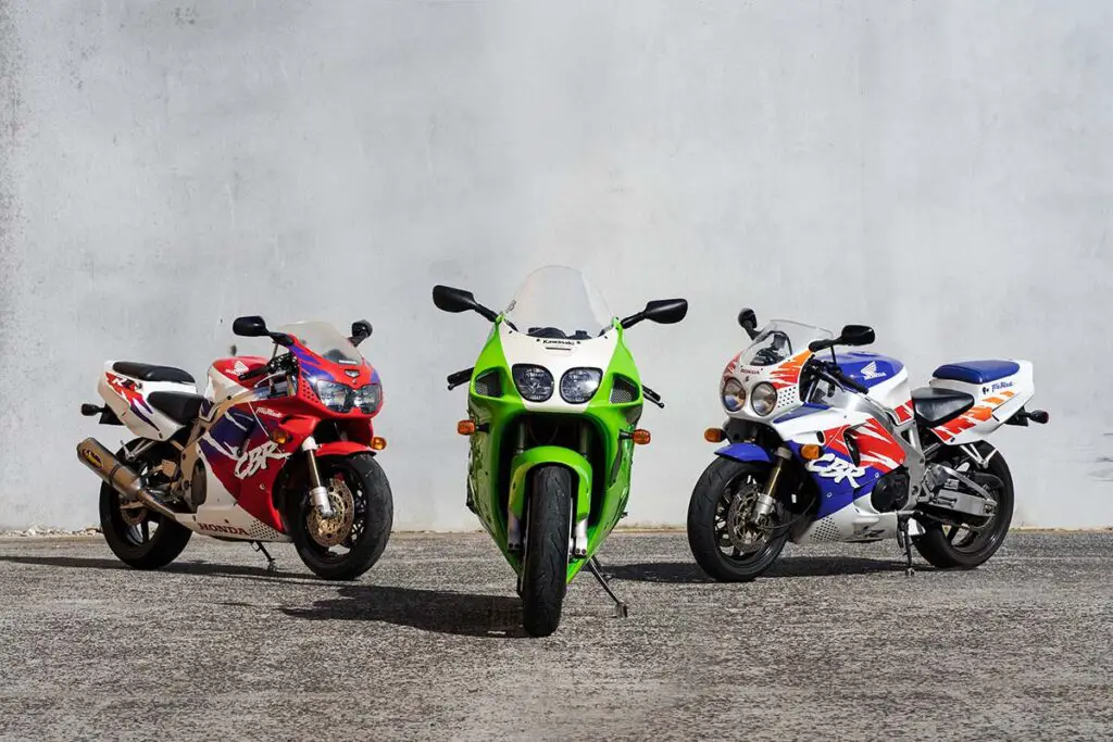 Three Motorcycles Parked Next to Each Other