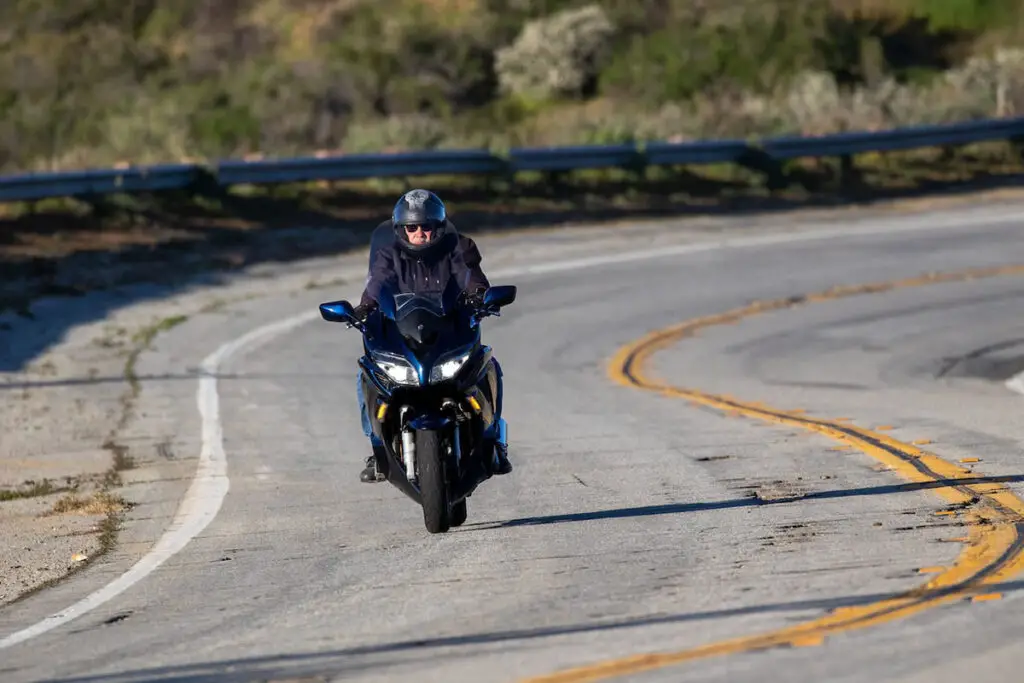 Riding a Motorcycle on a Winding Road