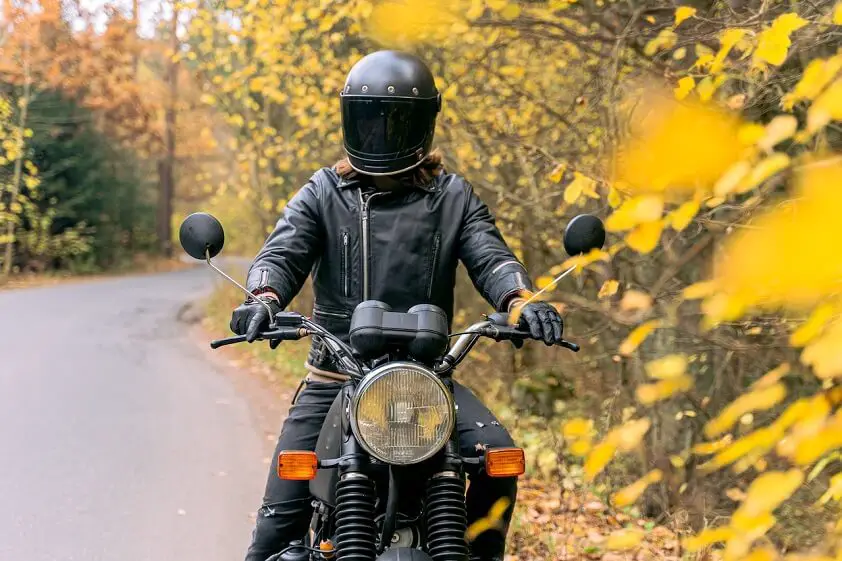 Person Riding Black Motorcycle